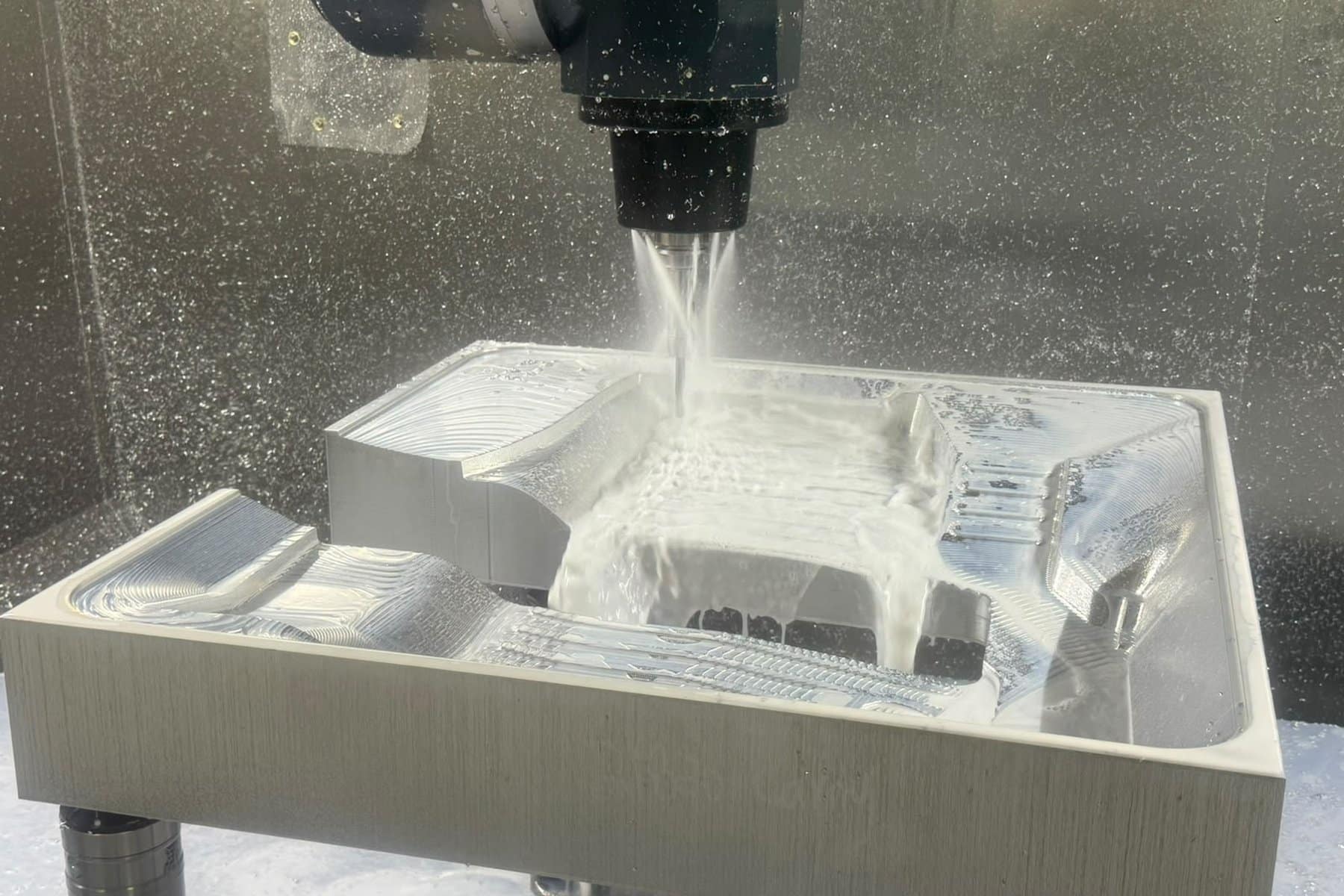 Timeline 25-axis CNC machining center cutting an aluminum tool at Avantech024 5 Axis Cnc